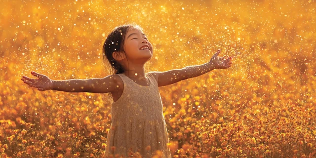 Joyful Child Embracing the Sunshine Concept Stock Photo