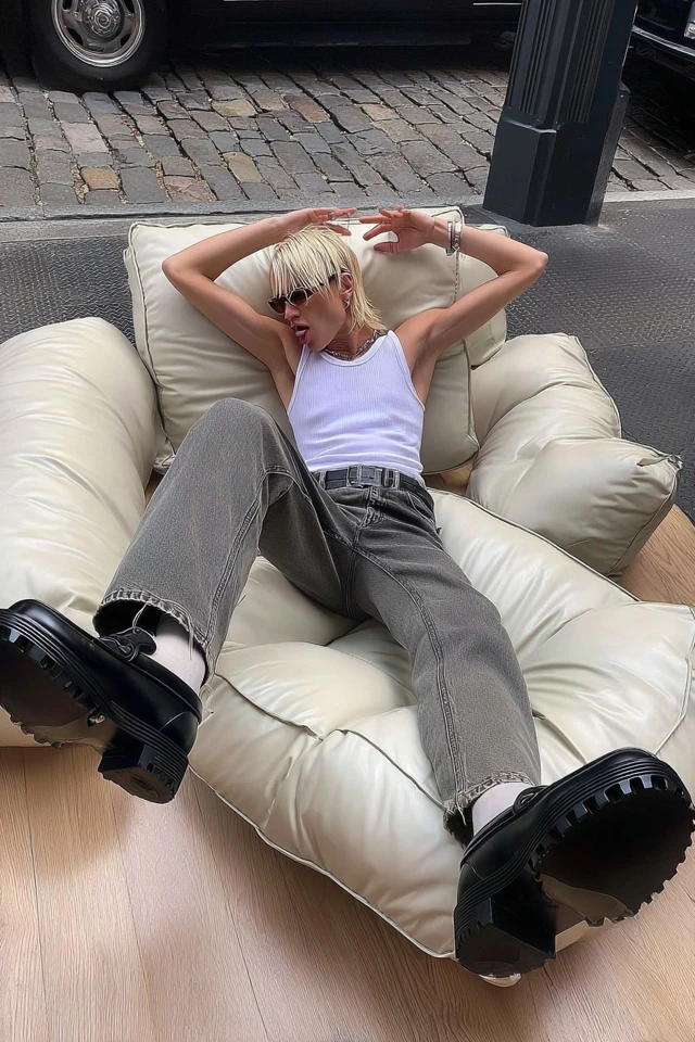 Cool Boy Relaxing in Oversized Jeans and Tank Top
