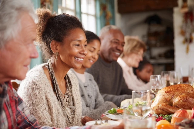Diverse Family Thanksgiving Meal Warmth and Togetherness