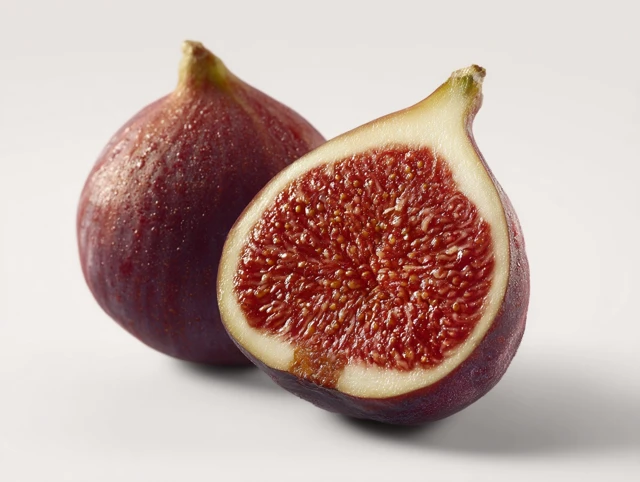 Fresh Fig Cut Open On White Background