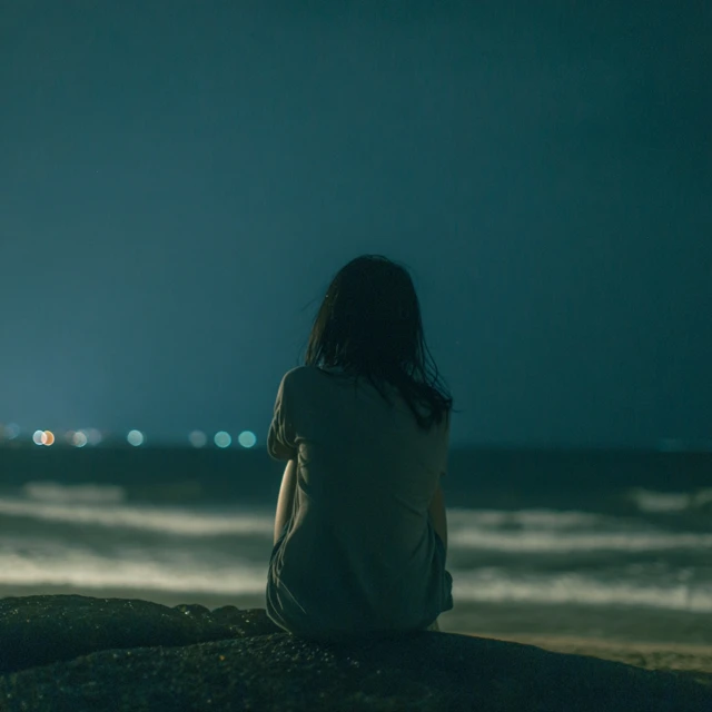 Vietnamese Woman Alone at Sea Emotional Scene
