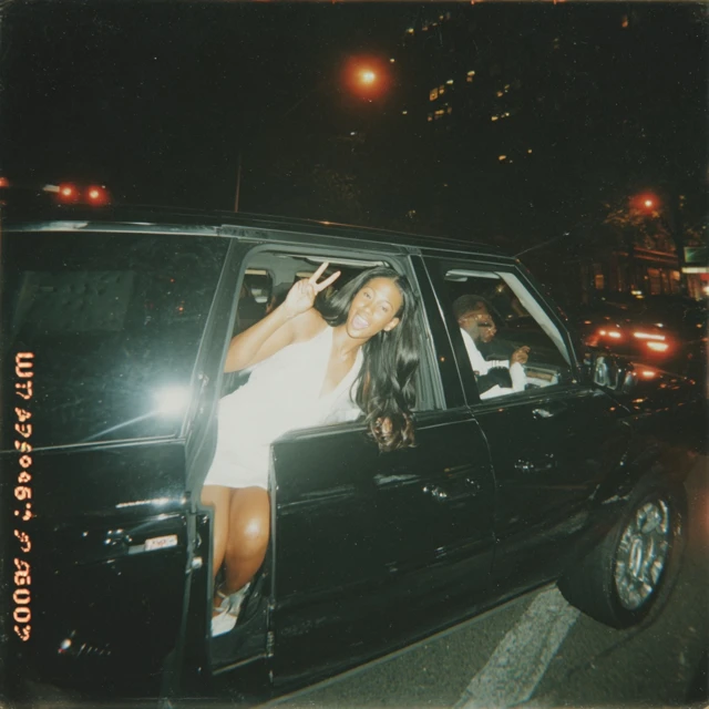 Nighttime Joy Black Woman in Range Rover iPhone Photo