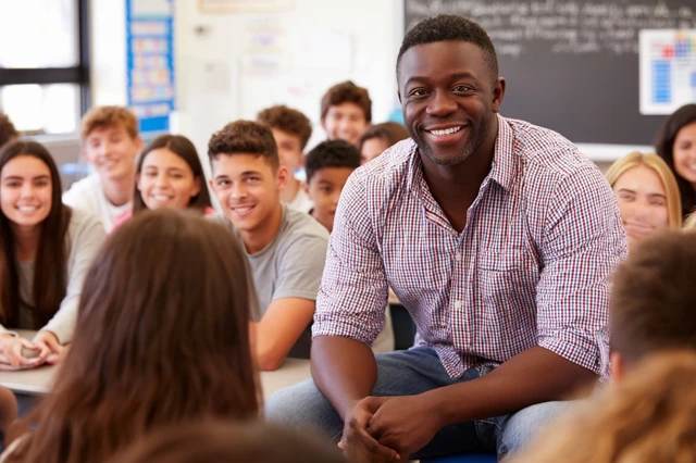 Teacher Explaining Lesson to Students Classroom