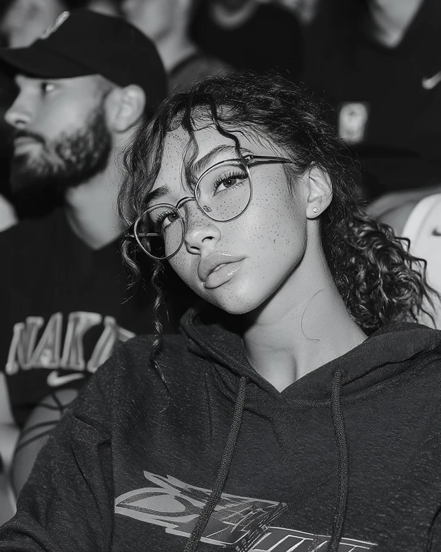 Girl in Glasses at Basketball Game