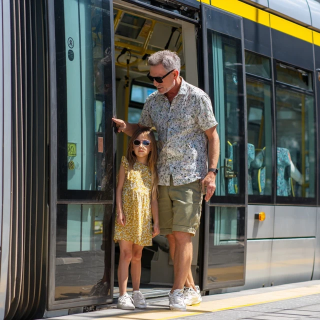 Father and Daughter on a Modern Tram 4K