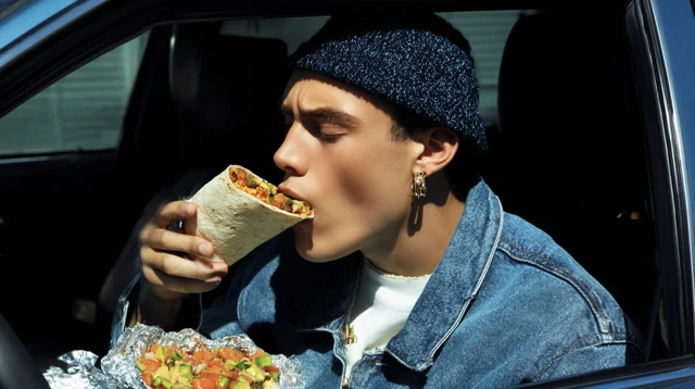 Young Man Eating Burrito in Car Photography