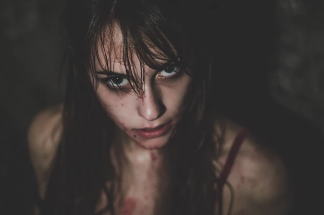 Portrait of a Moody Young Woman in the Dark