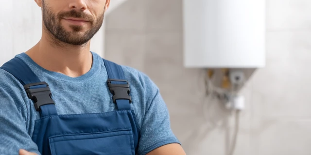 Professional Plumber by Water Heater High Detail Photo