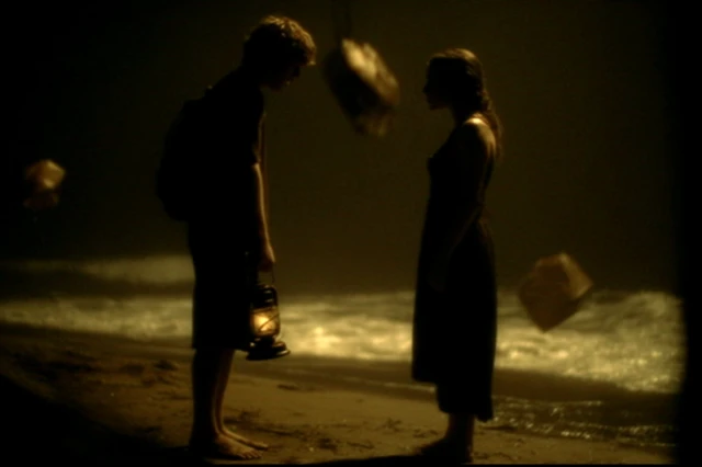 Night Beach Scene with Oil Lamps