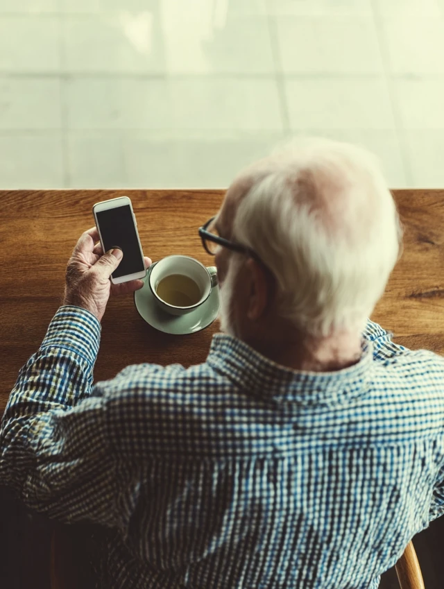 Cute Grandfather Relaxing with Tea