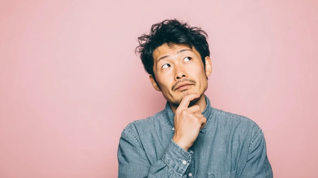 Thoughtful Japanese Man Stock Photo Portrait
