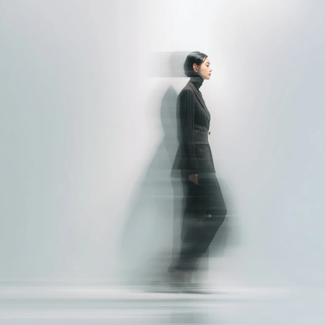 Stylish Woman in Tailored Suit Motion Blur
