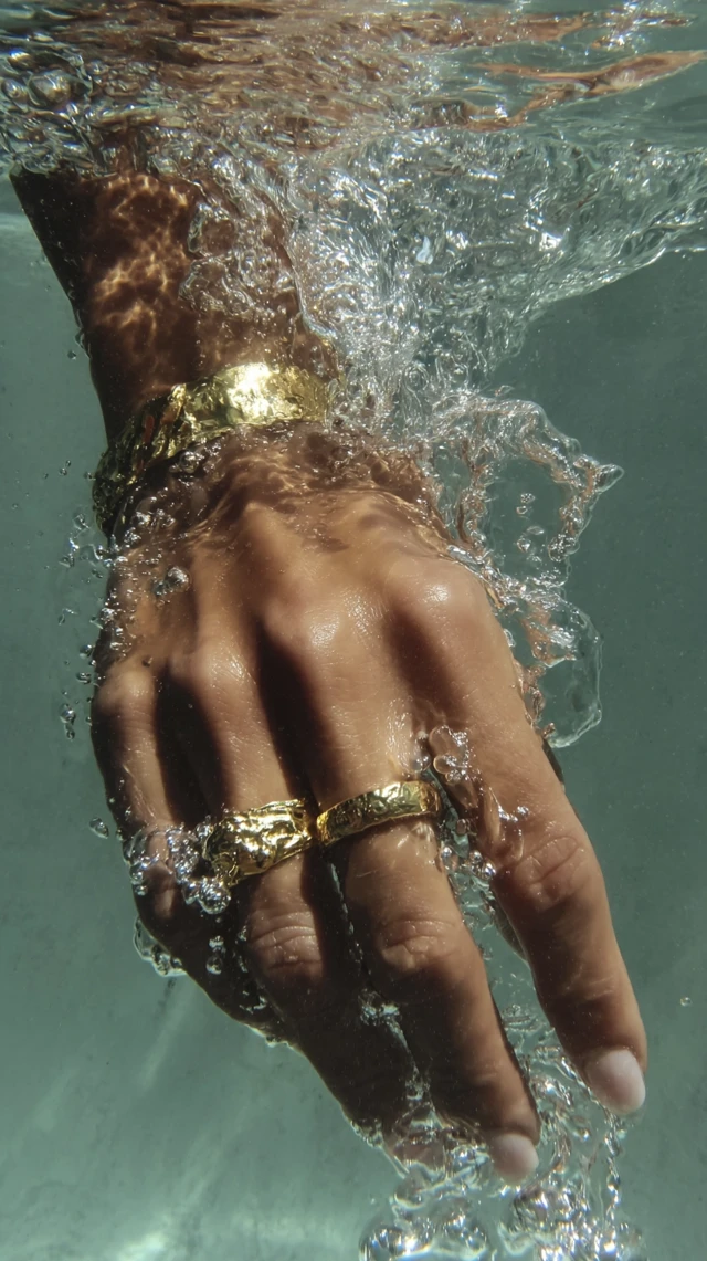 Luxury Hand Under Water Gold Rings Editorial Style