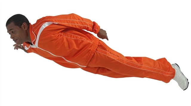 Man in Orange Sportswear Falling in Free Fall