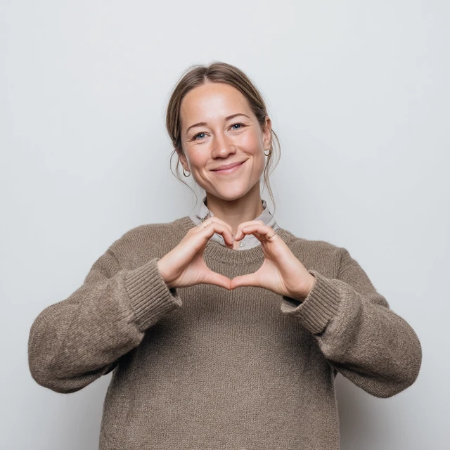 Smiling Woman Makes Heart Sign Photography