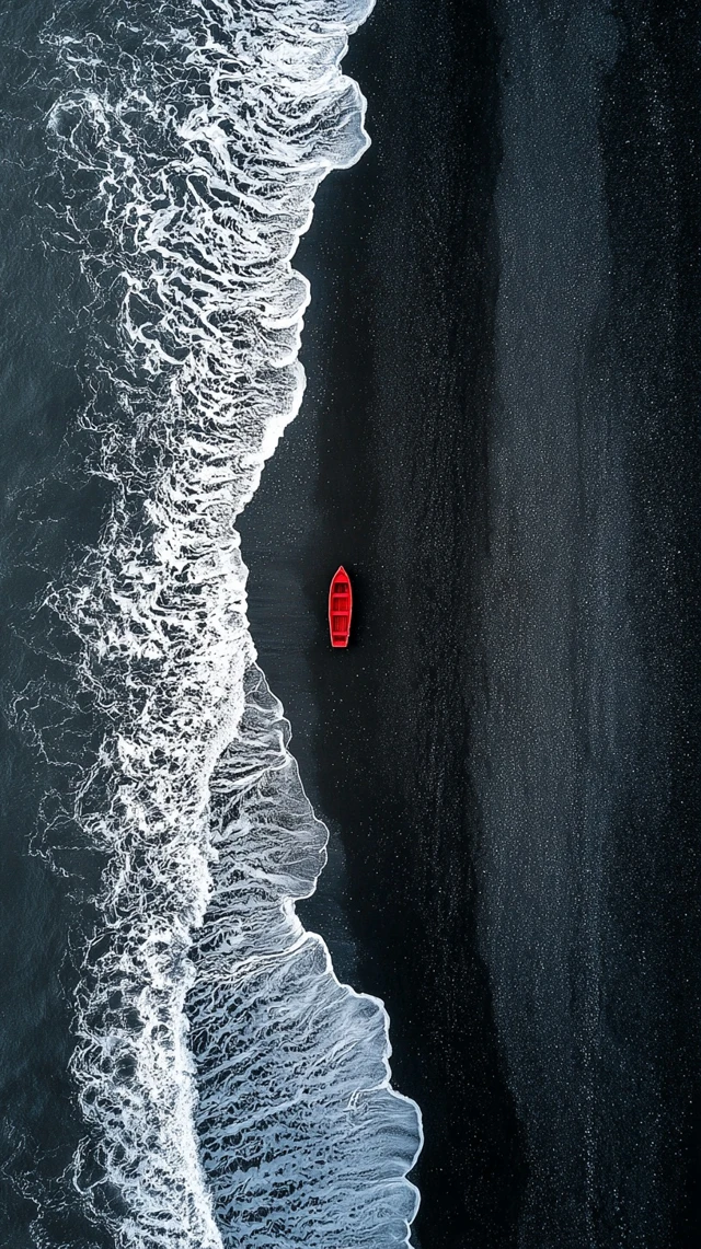 Red Boat on Black Sand Beach Iceland Aerial View