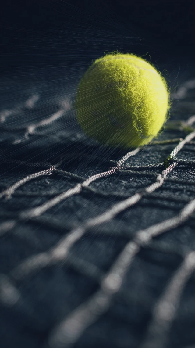 Tennis Ball Through Net Hyperrealistic Shot