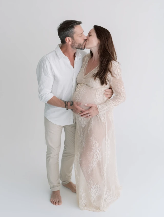 Romantic Pregnancy Photo Couple Kissing