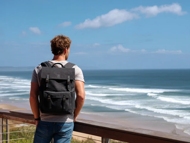 Man on Beach with Backpack Ocean View