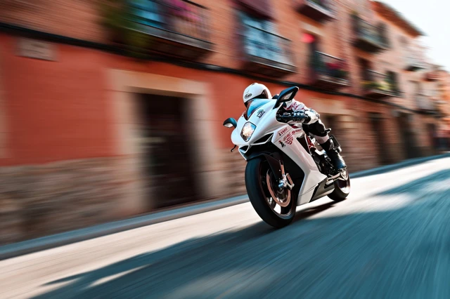 Motorcycle Rider Speeding Leaning in Corner Valencia Spain