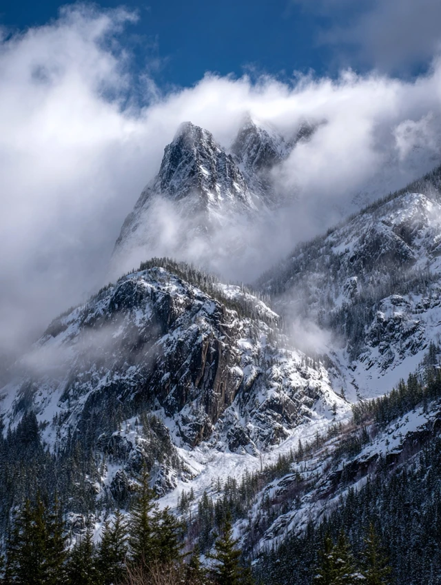 Snowy Mountain Scenery with Drifting Clouds