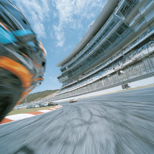 Race Car Action On The Track Dynamic Perspective