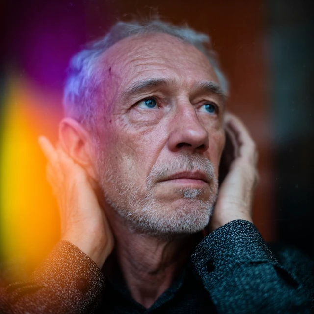 Portrait of a Confused Man Looking for Sound
