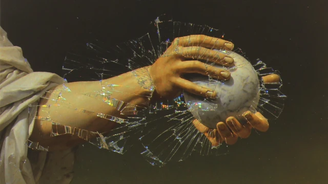 Broken Venus de Milo Arm Holding Apple