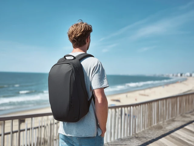 Man on Beach with Backpack Ocean View