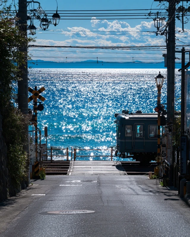Japanese Train Crossing Road by the Sea