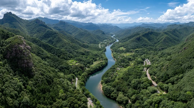 Verdant Mountains and Winding River Landscape