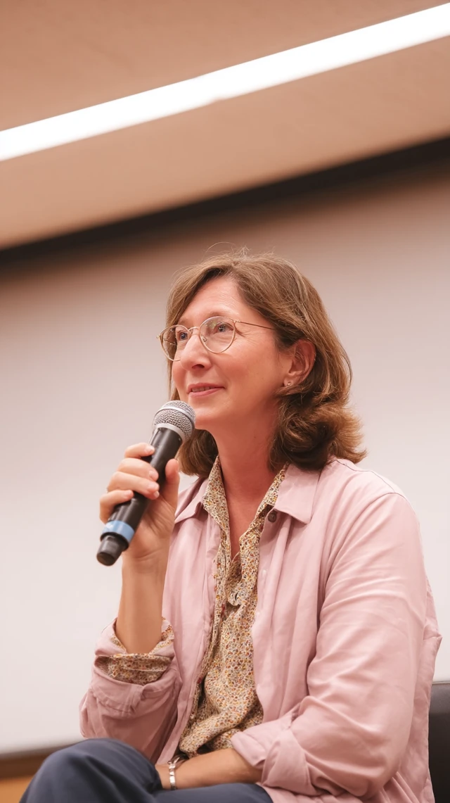 Woman on Stage Giving a Lecture Interview
