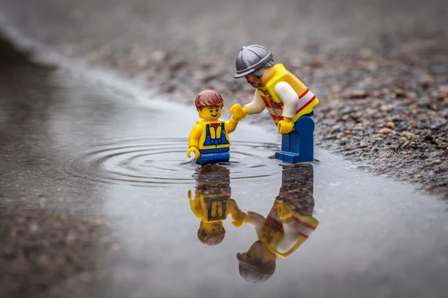 Lego Rescue Team Helping A Figure Photography