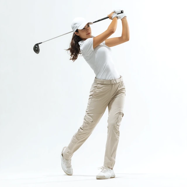 Female Golfer in Action Golf Swing White Outfit