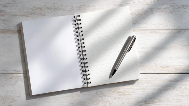Notebook and Pen on White Wooden Desk