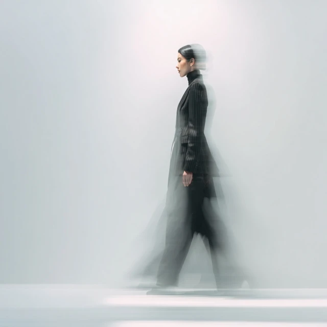 Stylish Woman in Tailored Suit Motion Blur