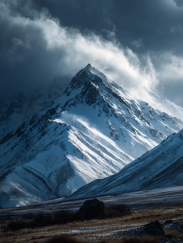 Snowy Mountain Scenery with Drifting Clouds
