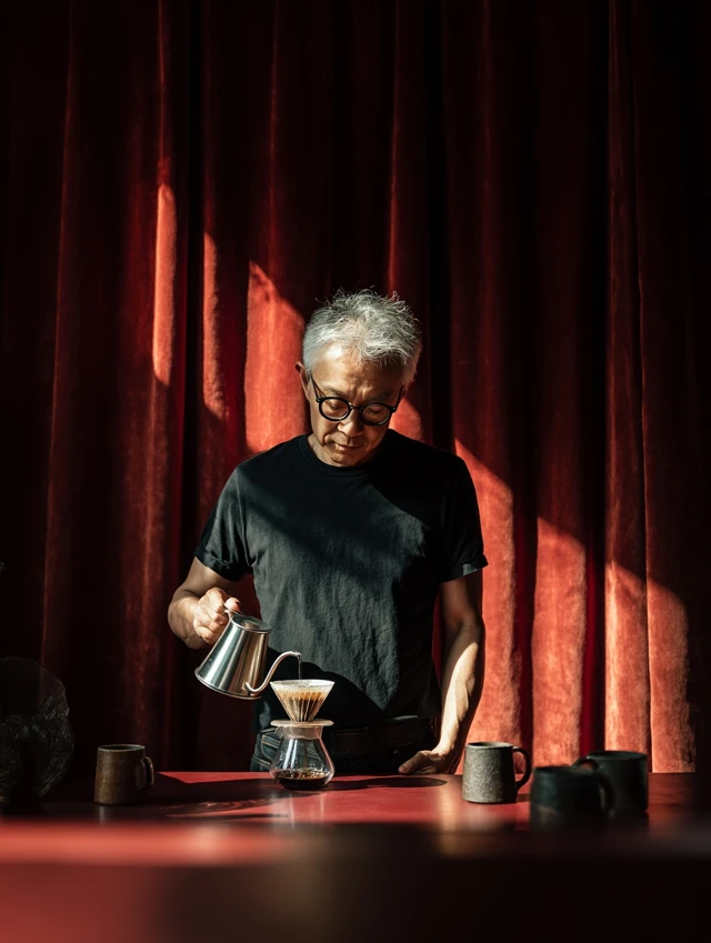 Man Brewing Coffee Pour Over Dramatic Lighting