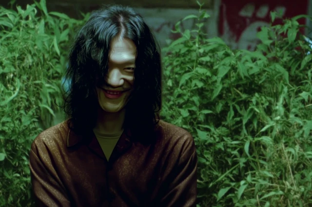 Eerie 90s Scene of Me Mania Against Green Foliage