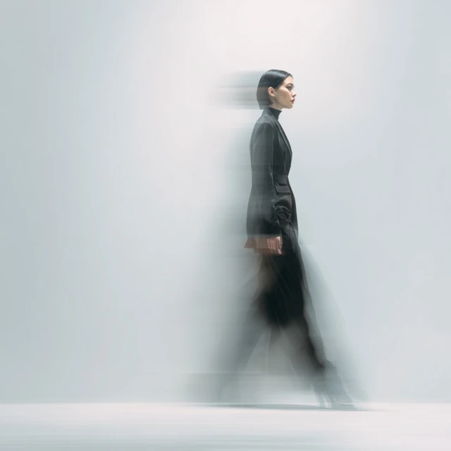 Stylish Woman in Tailored Suit Motion Blur