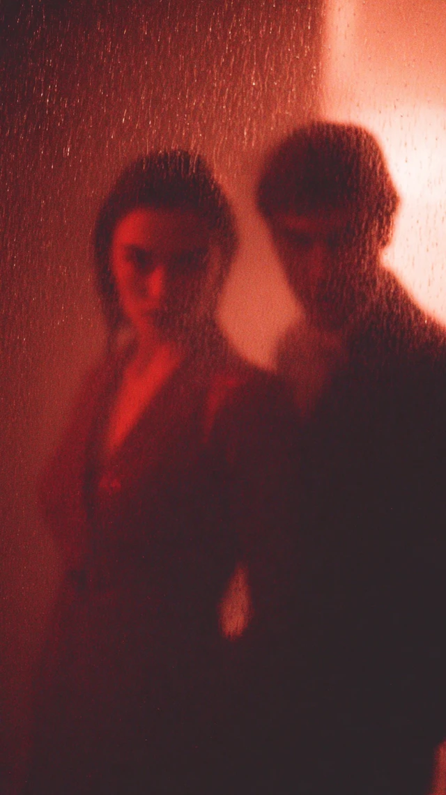 Couple in Rain Romantic Moment Dramatic Lighting