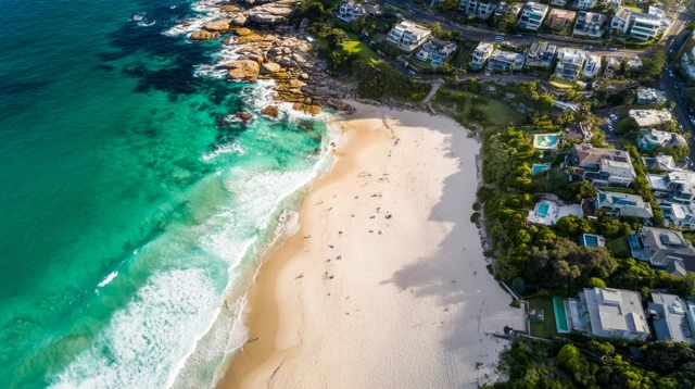 Coastal Beach Aerial View Turquoise Ocean and Lush Greenery