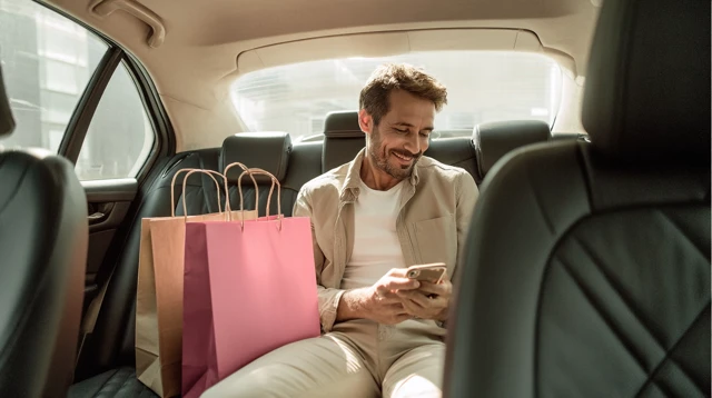 Argentinian Man in Taxi Modern Interior Smartphone Shopping
