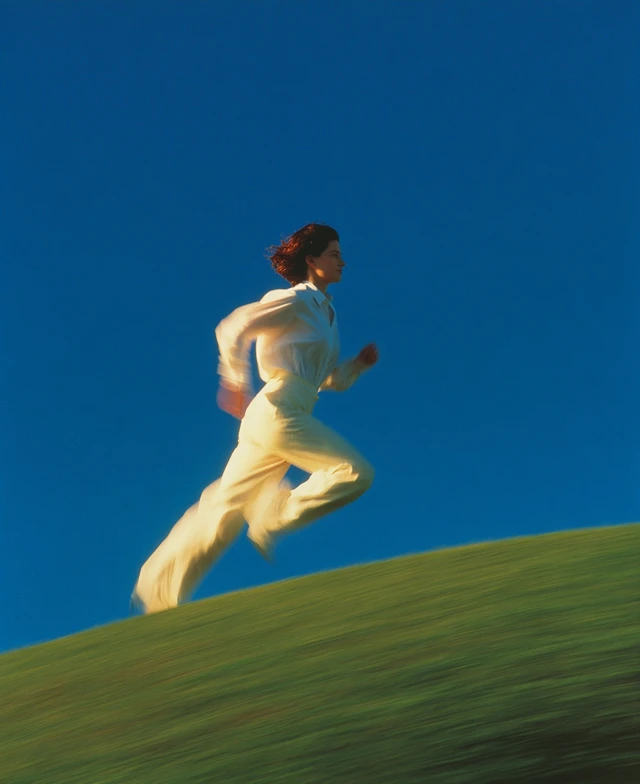 Woman Running on a Hill Photo in Peter Lindbergh Style