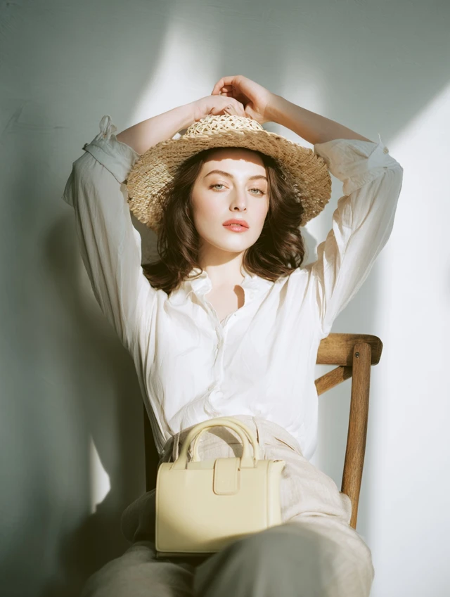 Elegant Woman in Straw Hat Editorial Photoshoot