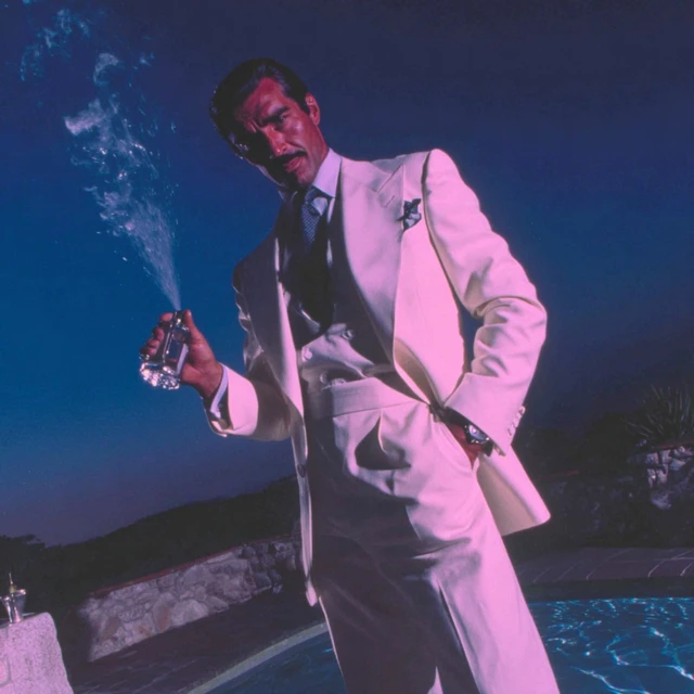 Suave Man in Summer Suit Perfume Ad