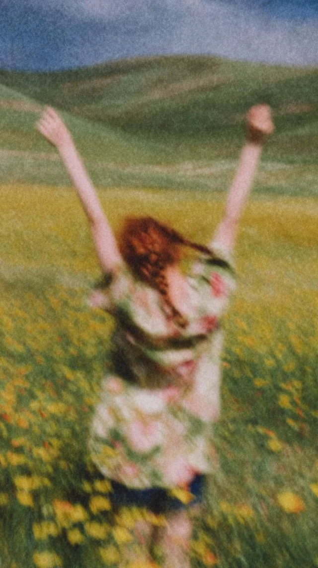 Red Haired Girl in Flower Field Freedom and Calm