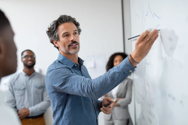 Business Presentation Man Pointing At Graph