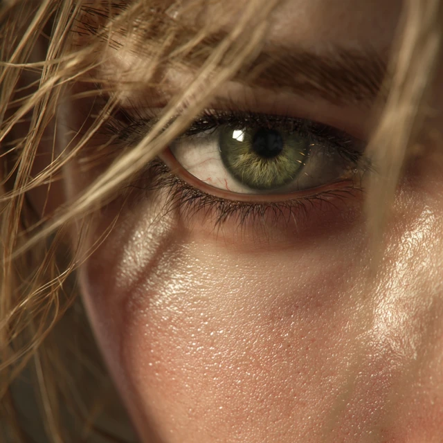 CloseUp of Female Eye with Golden Light and Blonde Hair