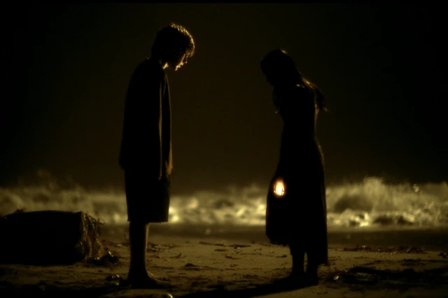 Night Beach Scene with Oil Lamps